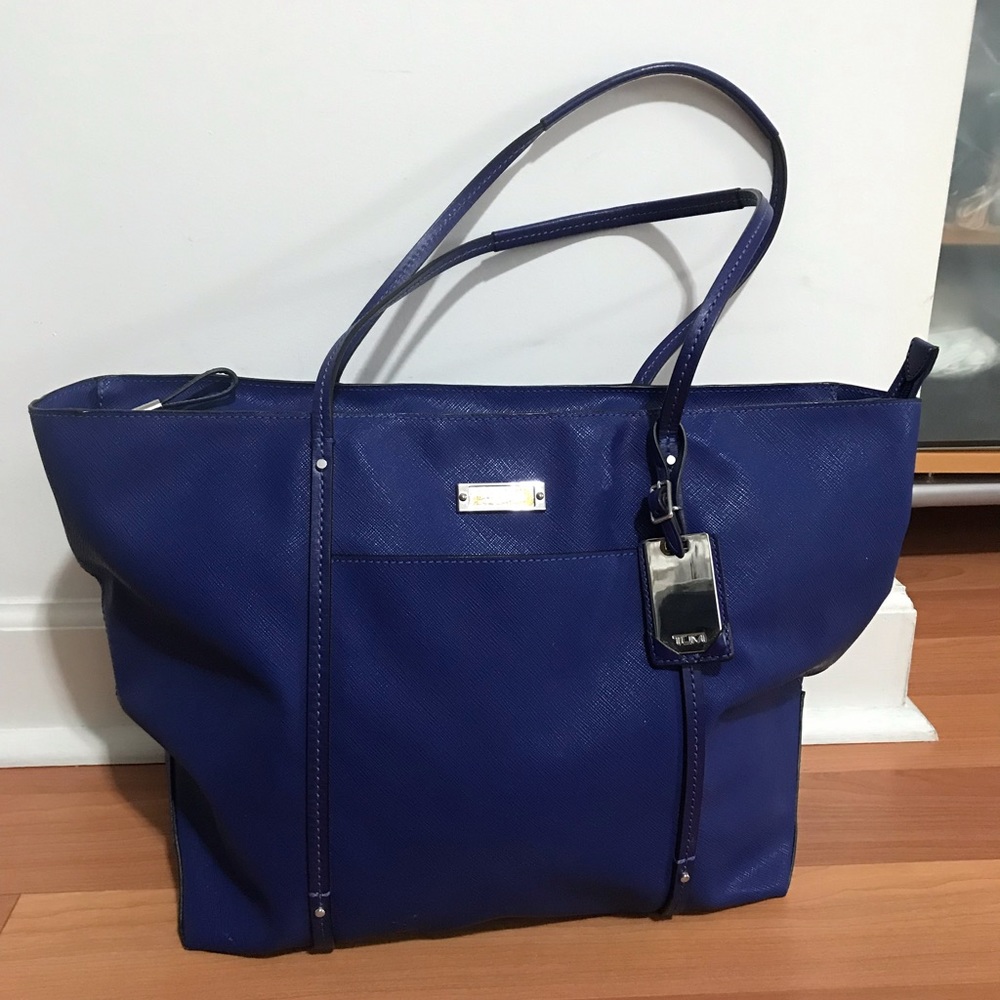 Lady’s Blue Tumi Bag, New with defect